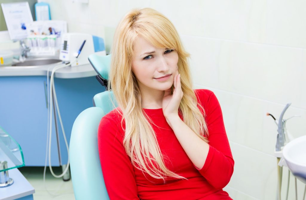 Blonde woman at dentist due to wisdom teeth pain