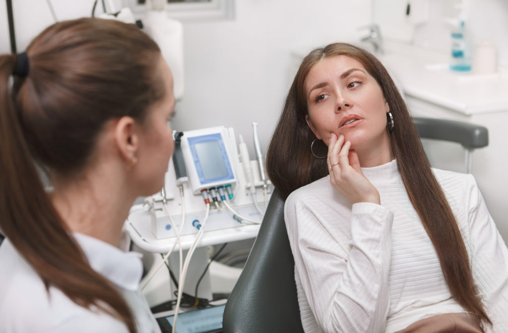 Women visiting dentist due to dental emergencies