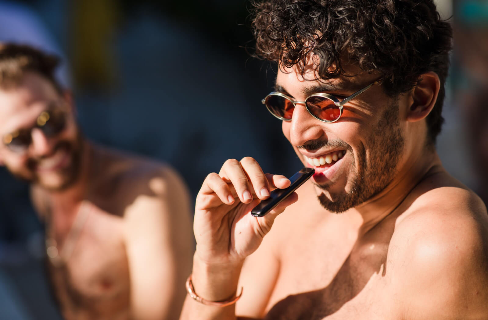 A young smokes a disposable electronic cigarette.